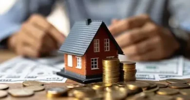 Roof financing costs with house model, coins, and money
